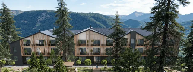 Фасад готельного комплексу Меланіт Resort & SPA з видом на Карпати